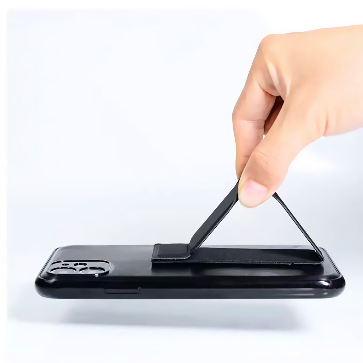 Portable Folding Design: Compact and lightweight, easy to carry and fold for use anytime, anywhere.
Multi-functional Stand: Serves as both a phone stand for stable support and a grip for easy handling.
Universal Compatibility: Suitable for various phone models, no compatibility issues to worry about.
Durable Material: Made from high-quality plastic, sturdy and long-lasting.
Simple and Elegant Style: The design is simple and elegant, suitable for various occasions, showcasing your fashion sense., Foldable Mini Phone Kickstand - Black