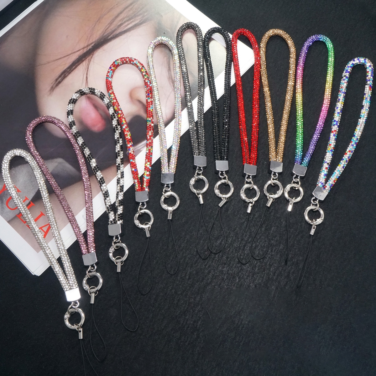 Multiple Color Options: Available in nine colors, including Multicolor, Rainbow, Chinese Red, Silver White, Shiny, Gold, Black, Black and White, and Red, to meet various personal preferences.
High-Quality Materials: Made from alloy and high-elastic cotton, ensuring durability and comfort.
Exquisite Craftsmanship: Handcrafted with fine workmanship and unique design.
Lightweight and Practical: Weighs only about 14g, with a folded length of approximately 24cm, making it easy to carry and use.
Versatile Use: Suitable for mobile phones, cameras, and other devices, also serves as a fashionable accessory.
Individual Packaging: Each wrist strap comes in individual packaging, ensuring product quality and hygiene., Fashion Mobile Phone Hand Wrist Strap Lanyard