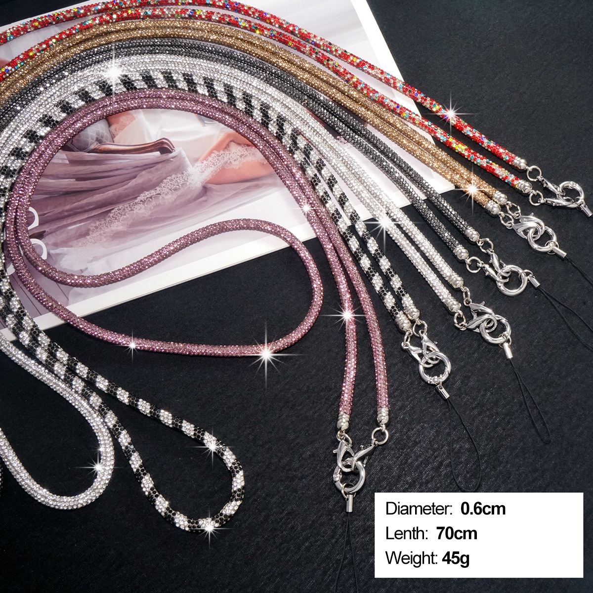 Colorful Options: Available in a variety of colors including rainbow, multicolor, blue, Chinese red, gold, black and white, red, and purple, perfect for showing personal style.
Premium Materials: Made with alloy metal clasps and high-elastic cotton straps for durability and comfort.
Handcrafted: Each piece is meticulously handcrafted, with attention to detail that speaks to quality.
Practical Design: Featuring a diamond-studded crossbody chain with a diameter of 0.6cm, folded length of about 70cm, and weighing only about 45g, it